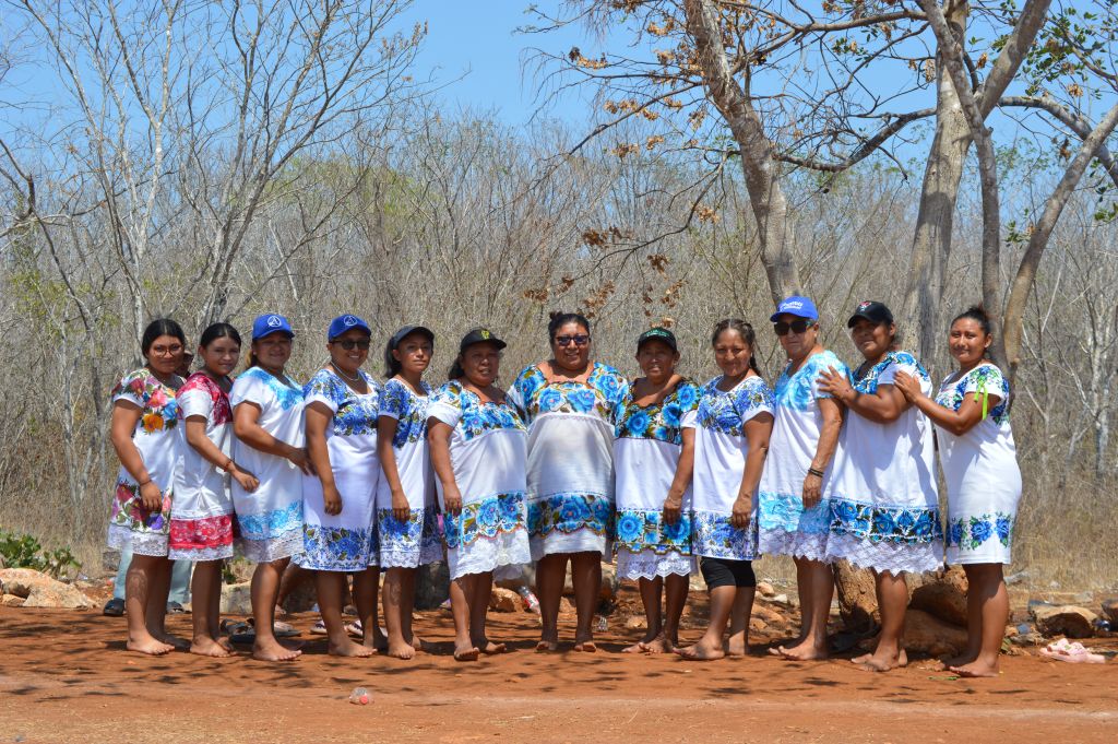 The Amazonas of Yaxunah pose for a team photo before their game against the Águilas de San Antonio played at a local park in Halachó, a small municipality in México’s Yucatán Peninsula. They are wearing their traditional Huipil embroided dresses. Most are embroided in blue, and two in different shades of pink.
