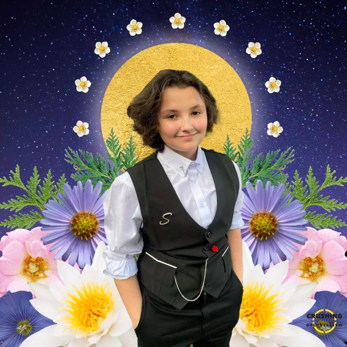 A photo of Nex Benedict wearing a White Button up shirt with a Black Vest with their hands in the pockets of their black pants against a starry sky, Nex Benedict is standing in front of a halo-like circle and is surrounded by flowers.