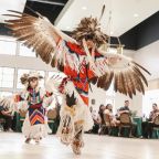 A photo of brothers Spotted-Eagle Baez-Smith and Eagle Talon Baez (Mohawk/Navajo/Coahuiltecan). Curcie illustrates the importance of healing through the eagle dance. Photo credit: Judy Campa, June 2023.