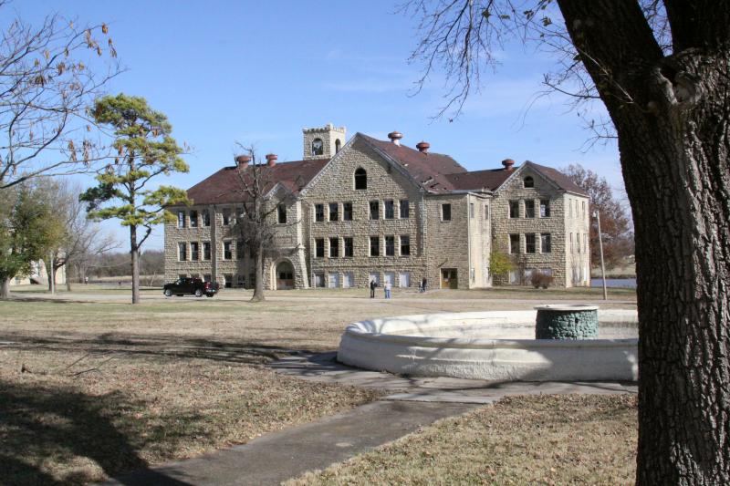 a photo of a Chilocco Indian School building abandoned against a blue clear sky.