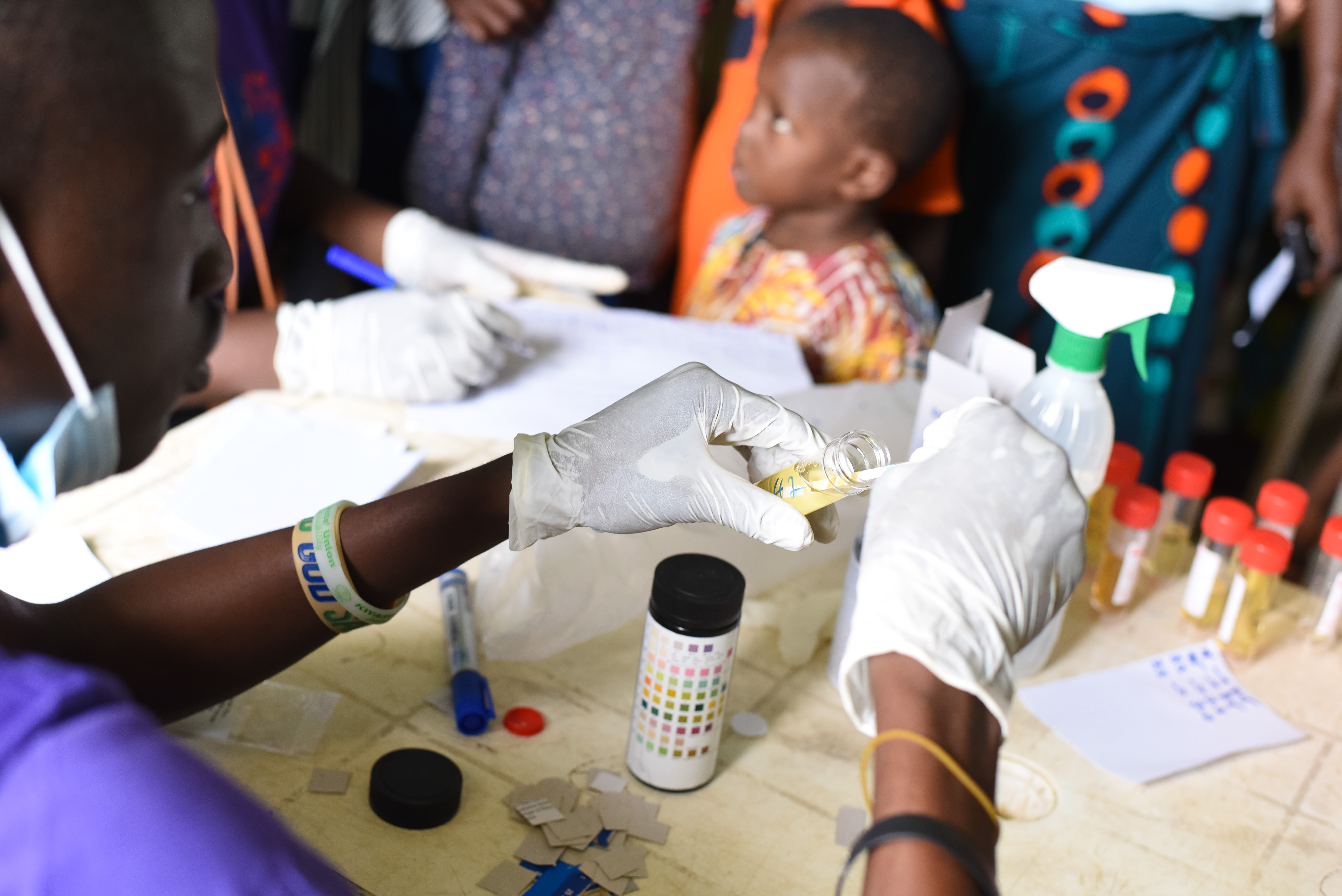 Medical volunteers in Ido Local Government meticulously label and track every patient sample. This careful documentation ensures that each resident receives the specific medication required to treat the water-borne symptoms identified during their consultation. Photo credit: Bukunmi Oyewole, December 11, 2020.