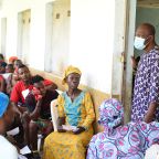 Residents of Langbin community gather in the waiting area as Mr. Adeboye coordinates the flow of patients during the medical outreach in the community. His role was central to managing the high volume of over 250 people, ensuring that each individual moved efficiently from the initial briefing to their clinical consultations and pharmacy pick-ups. Photo credit: Bukunmi Oyewole, December 11, 2020.