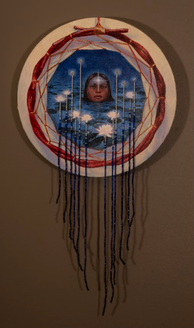 Based on the traditional story of how water lilies came to be, when a star decided she wanted to live on Earth near people and took the form of a flower growing on water to be near the reflections of her sisters who still lived in the sky. The circular artwork depicts the face of an Indigenous person emerging from a body of water surrounded by blooming white water lilies. The painted image is framed by a red willow hoop, while delicate blue and white beadwork extends from the flowers into long strands that cascade below the piece, creating the impression of flowing water. The artwork blends painting and beadwork.